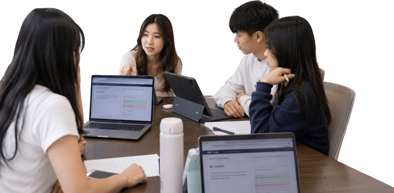 Four students working through a practice test together at one table